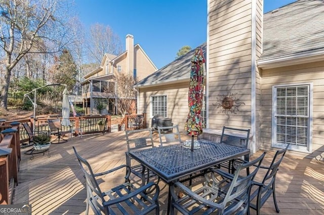 deck with outdoor dining space