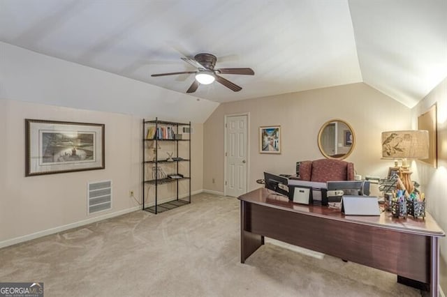 home office with a ceiling fan, baseboards, lofted ceiling, carpet flooring, and visible vents