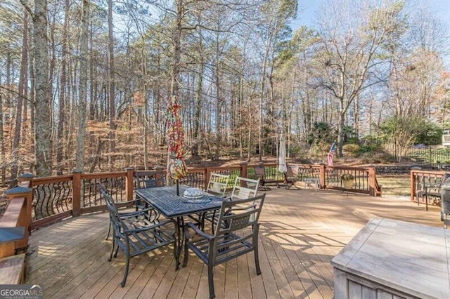 deck with outdoor dining area