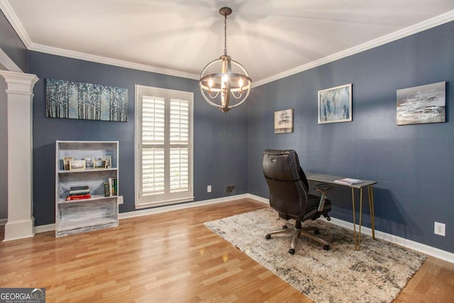 office space featuring wood-type flooring, ornamental molding, and a notable chandelier