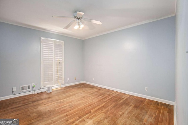 unfurnished room featuring ceiling fan, light hardwood / wood-style floors, and crown molding