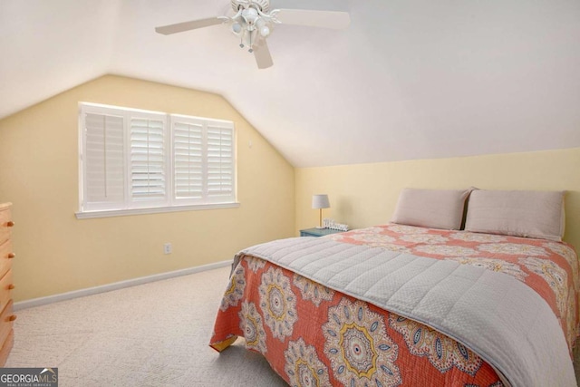 bedroom with carpet flooring, ceiling fan, and lofted ceiling