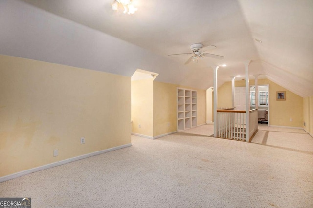 bonus room with ceiling fan, light colored carpet, lofted ceiling, and built in shelves