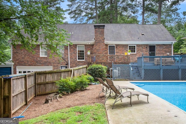 view of pool featuring a wooden deck