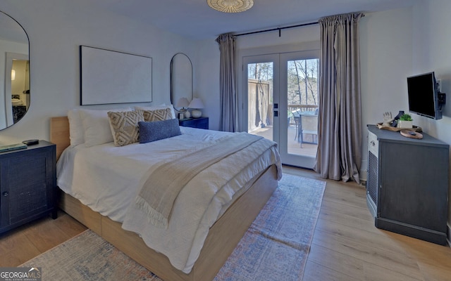bedroom with light wood-style flooring, french doors, and access to exterior
