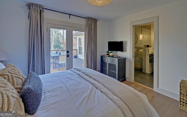 bedroom with access to exterior and light hardwood / wood-style flooring