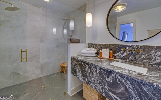 bathroom featuring vanity and a shower with door