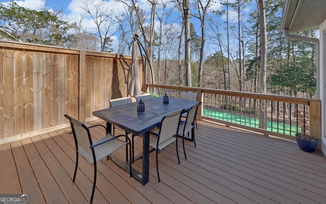 deck featuring outdoor dining area