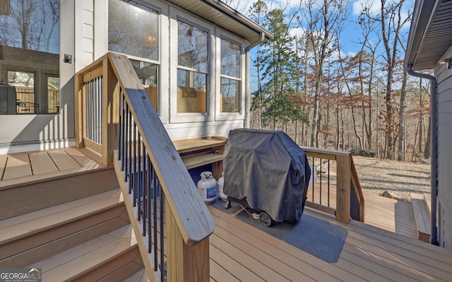 wooden deck featuring grilling area