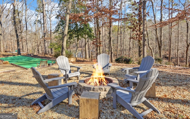 view of yard with an outdoor fire pit