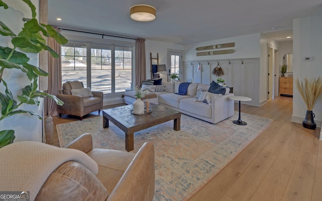 living room featuring light wood finished floors and recessed lighting