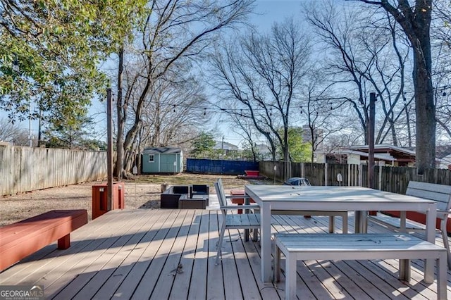 wooden terrace featuring a shed