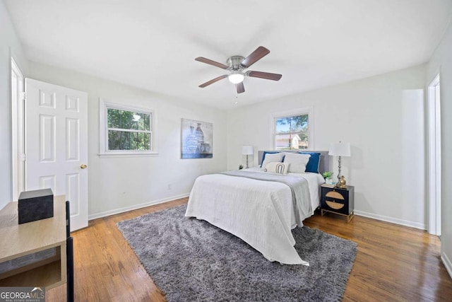 bedroom with hardwood / wood-style flooring and ceiling fan