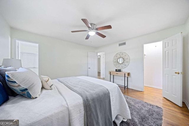 bedroom featuring ceiling fan and hardwood / wood-style flooring