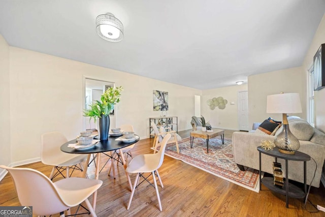 dining room with hardwood / wood-style floors