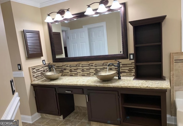 bathroom featuring a bath, tile patterned floors, decorative backsplash, vanity, and ornamental molding