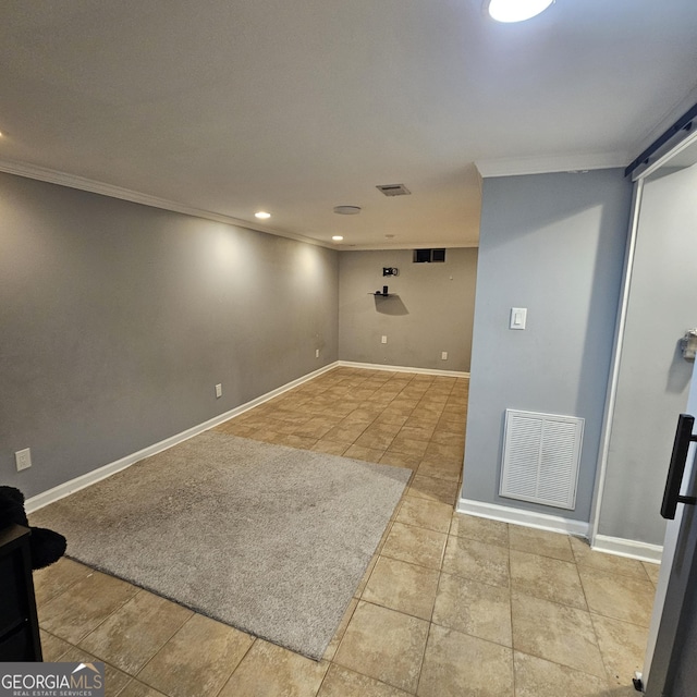 basement with light tile patterned flooring and ornamental molding