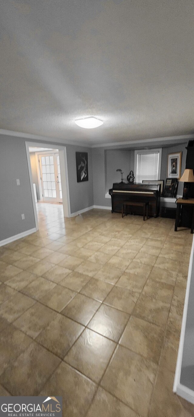 unfurnished living room with a textured ceiling