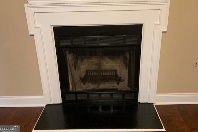 interior details featuring hardwood / wood-style flooring