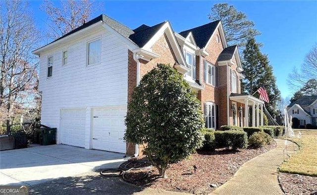 view of side of property featuring a garage