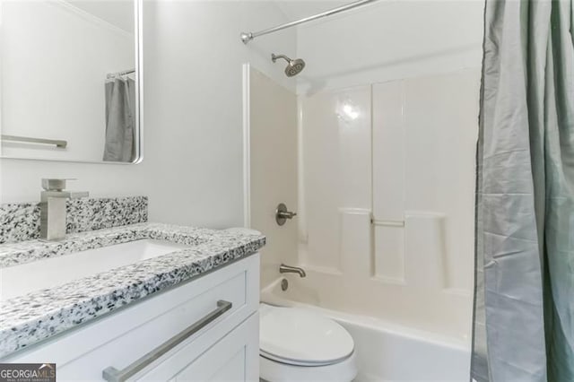 full bathroom with vanity, ornamental molding, shower / tub combo, and toilet