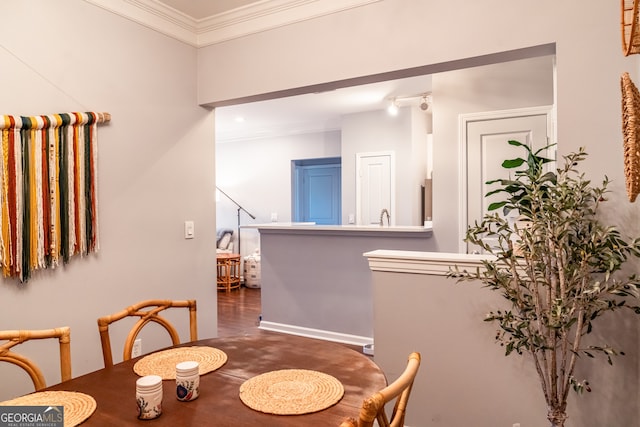 dining area with crown molding