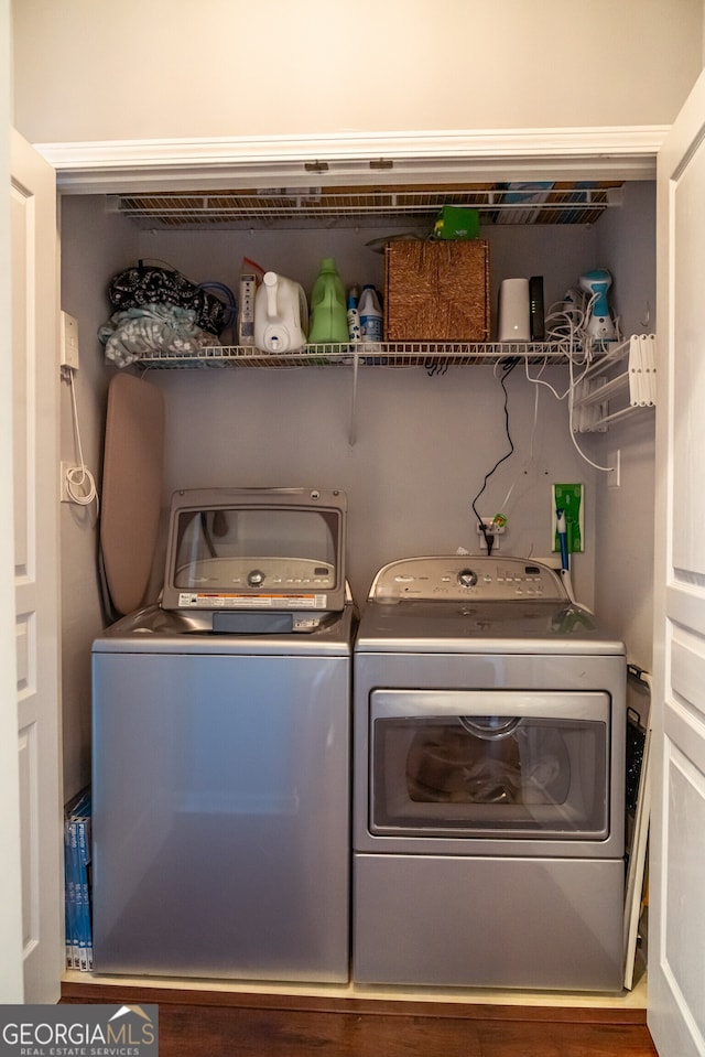 laundry area featuring washing machine and clothes dryer