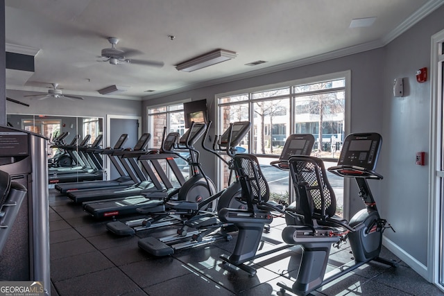 exercise room featuring plenty of natural light, ornamental molding, and ceiling fan