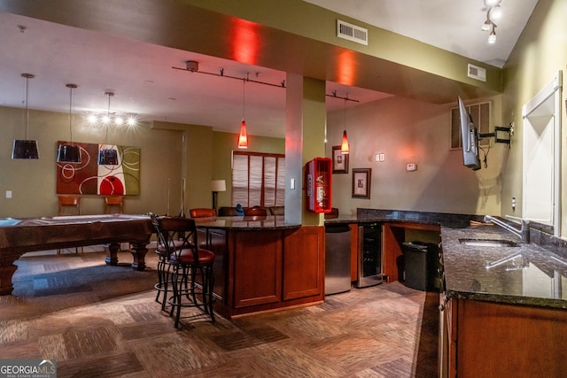 bar with dishwasher, sink, wine cooler, decorative light fixtures, and pool table