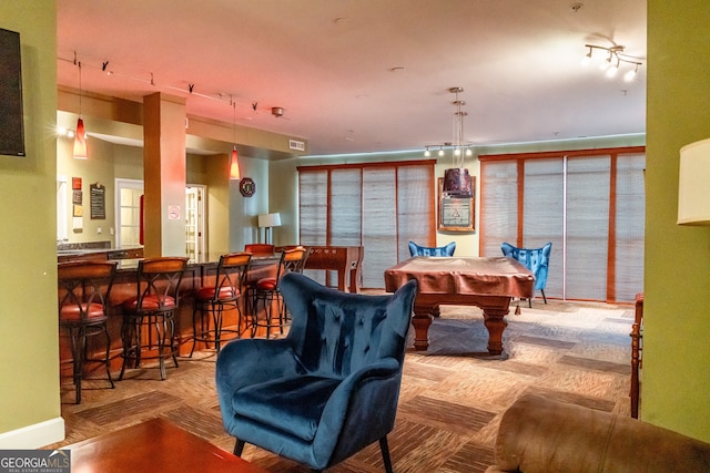 playroom with bar and pool table