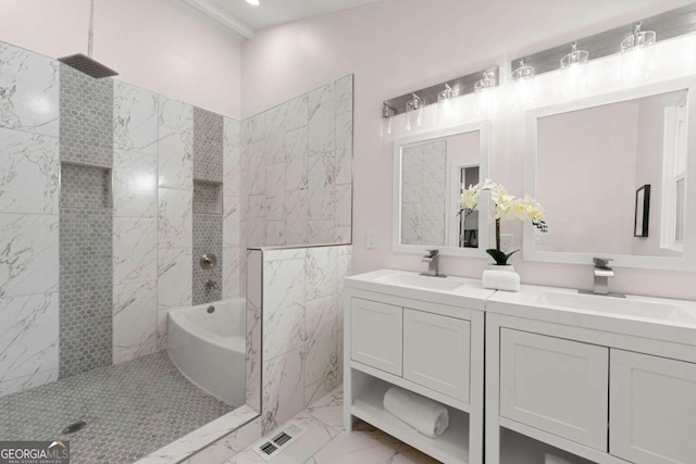 bathroom featuring vanity and independent shower and bath