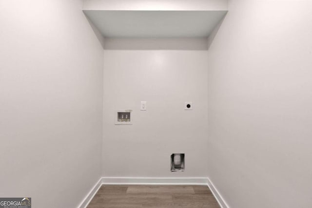 clothes washing area with electric dryer hookup, hookup for a washing machine, and hardwood / wood-style floors