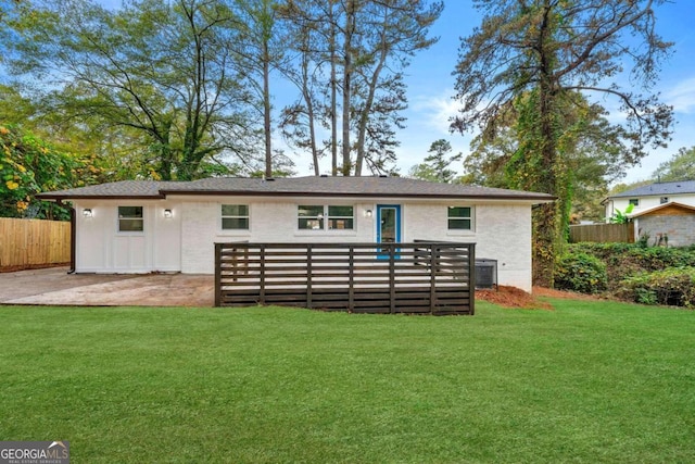 back of house featuring a yard and a patio area