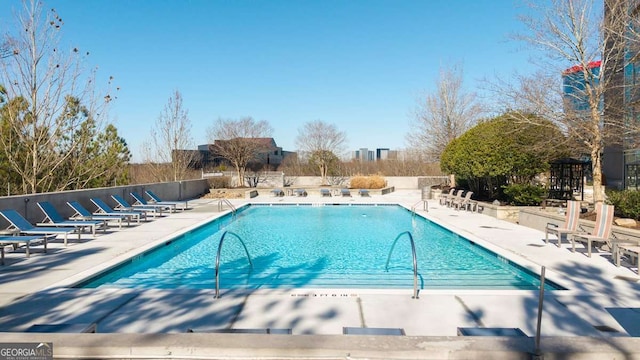 view of swimming pool featuring a patio area