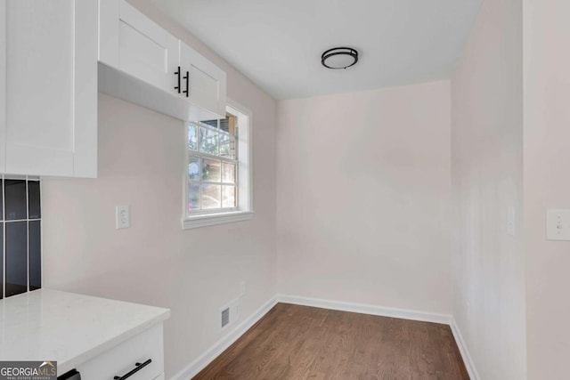 dining room with dark wood-type flooring