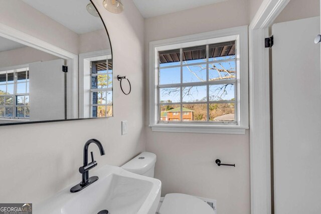 bathroom with toilet and sink