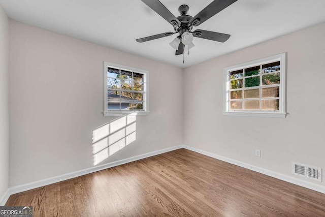 unfurnished room featuring ceiling fan and wood-type flooring