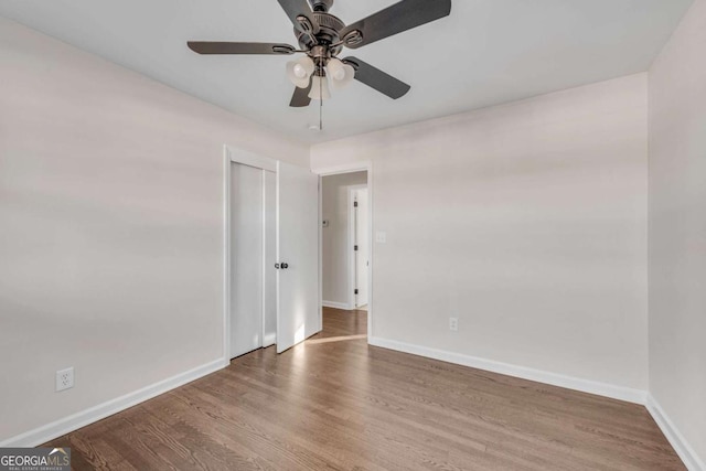 unfurnished room featuring hardwood / wood-style flooring and ceiling fan