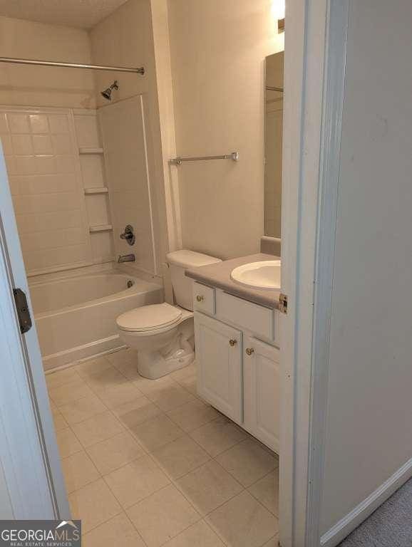 full bathroom featuring tile patterned flooring, vanity, shower / bathtub combination, and toilet