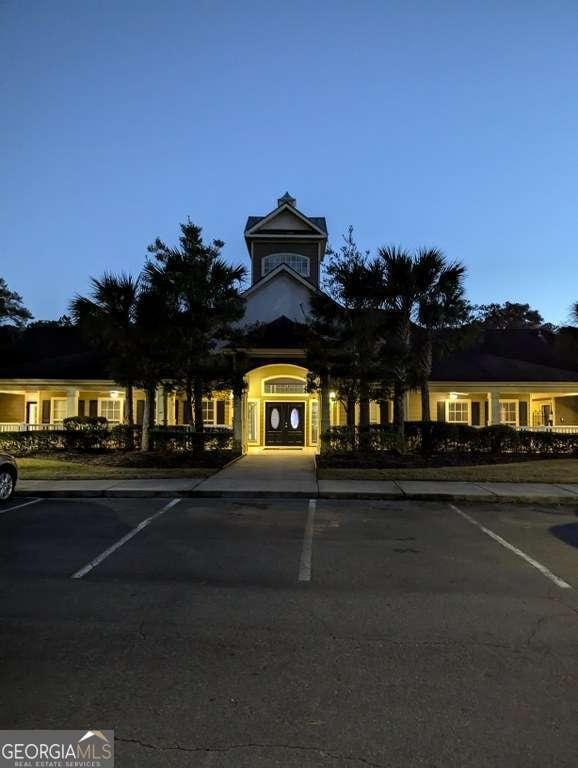 view of outdoor building at dusk