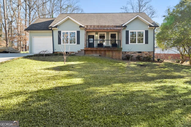 single story home featuring covered porch, a garage, and a front yard