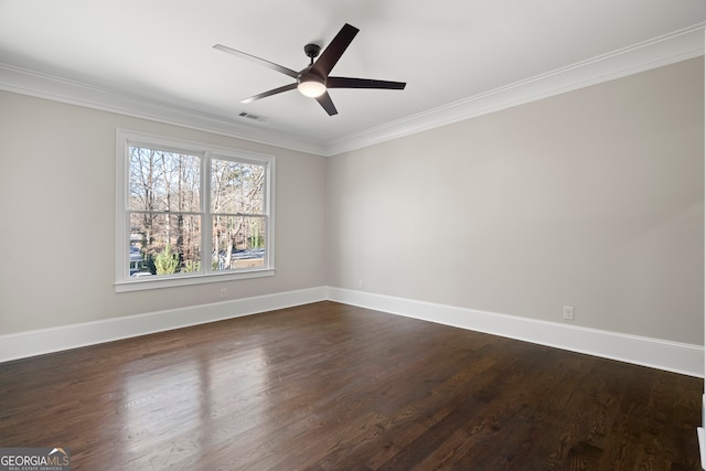 empty room with ceiling fan, dark hardwood / wood-style flooring, and crown molding