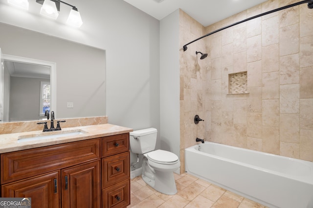 full bathroom featuring vanity, tiled shower / bath combo, and toilet