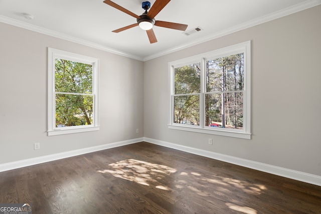 empty room with ceiling fan, dark hardwood / wood-style floors, and ornamental molding