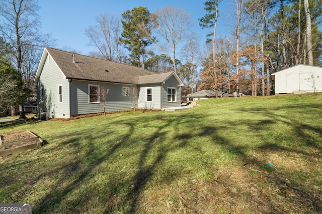 rear view of house with a lawn