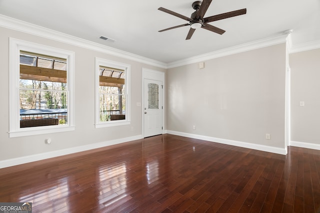 unfurnished room with dark hardwood / wood-style flooring, ceiling fan, and crown molding