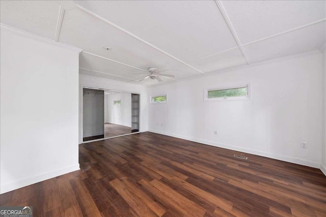 unfurnished room featuring dark wood-type flooring and ceiling fan