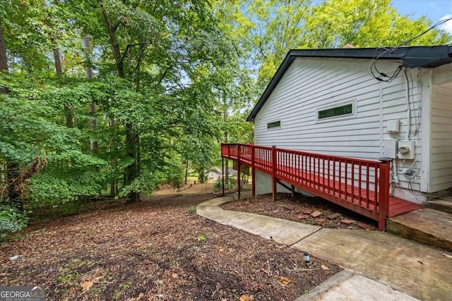 view of yard with a wooden deck