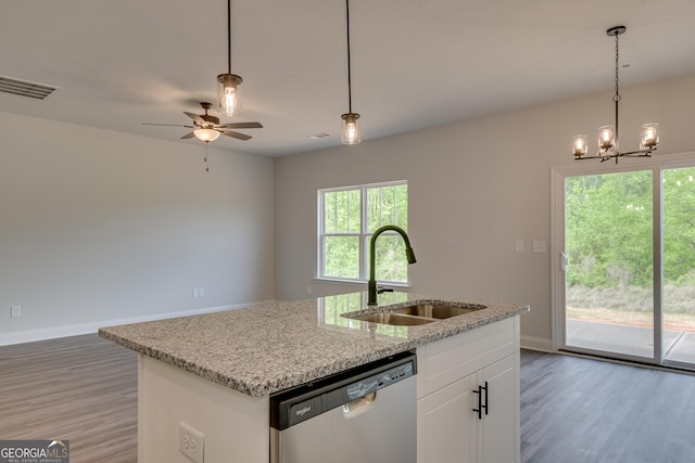 kitchen featuring white cabinets, a kitchen island with sink, sink, decorative light fixtures, and dishwasher