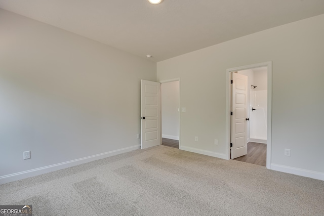 unfurnished bedroom with light carpet